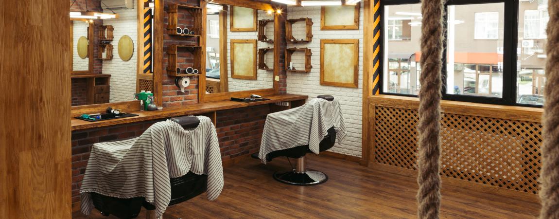 Two empty chairs in a barber shop